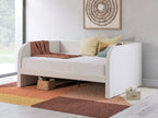 Upholstered day bed in beige fabric with white cushions; two under-bed drawers