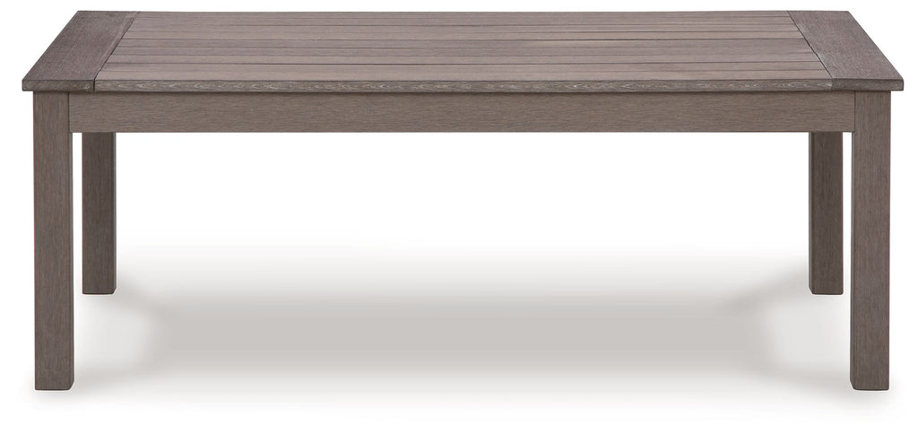 Rectangular cocktail table with brown top and four straight legs