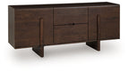 Medium brown accent cabinet with two doors and center drawer, dark pull handles.