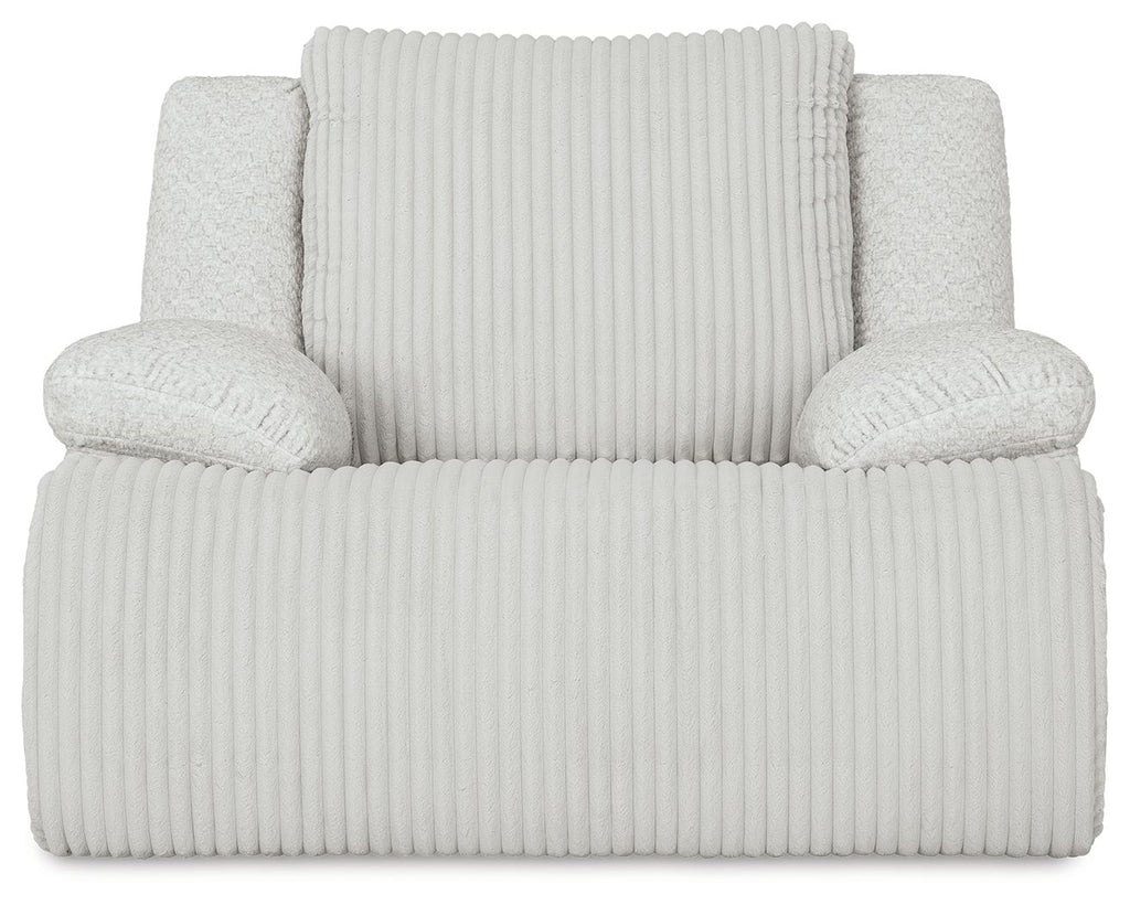 Light rocker recliner chair with ribbed upholstery and two plush side arms