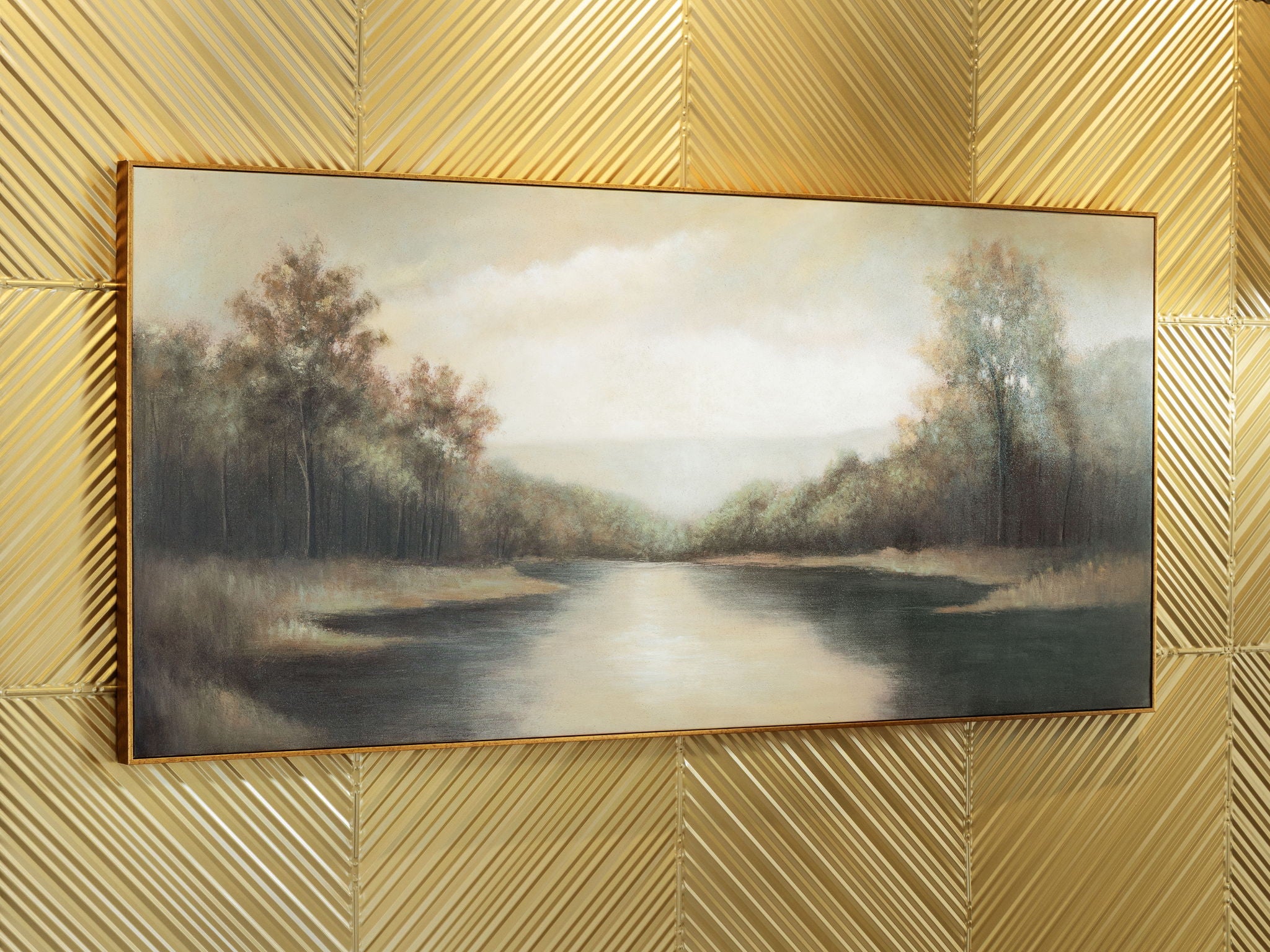 Framed wide river landscape painting with autumn-toned trees and cloudy light sky