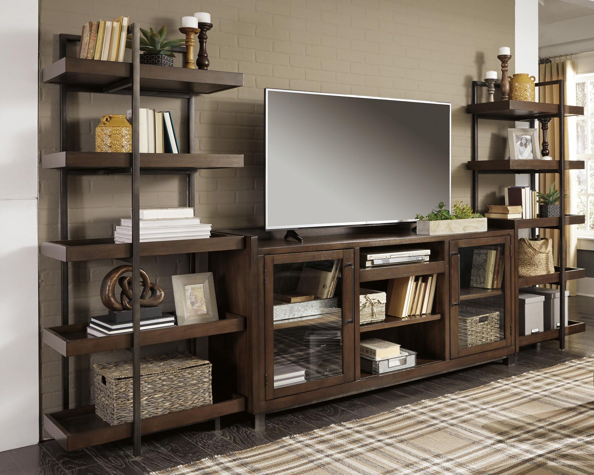 Dark brown TV stand with open cubbies, tiered shelves, and faux firebox insert
