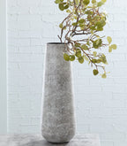 Tall ceramic vase in light gray with speckled texture, wide rounded rim and base.