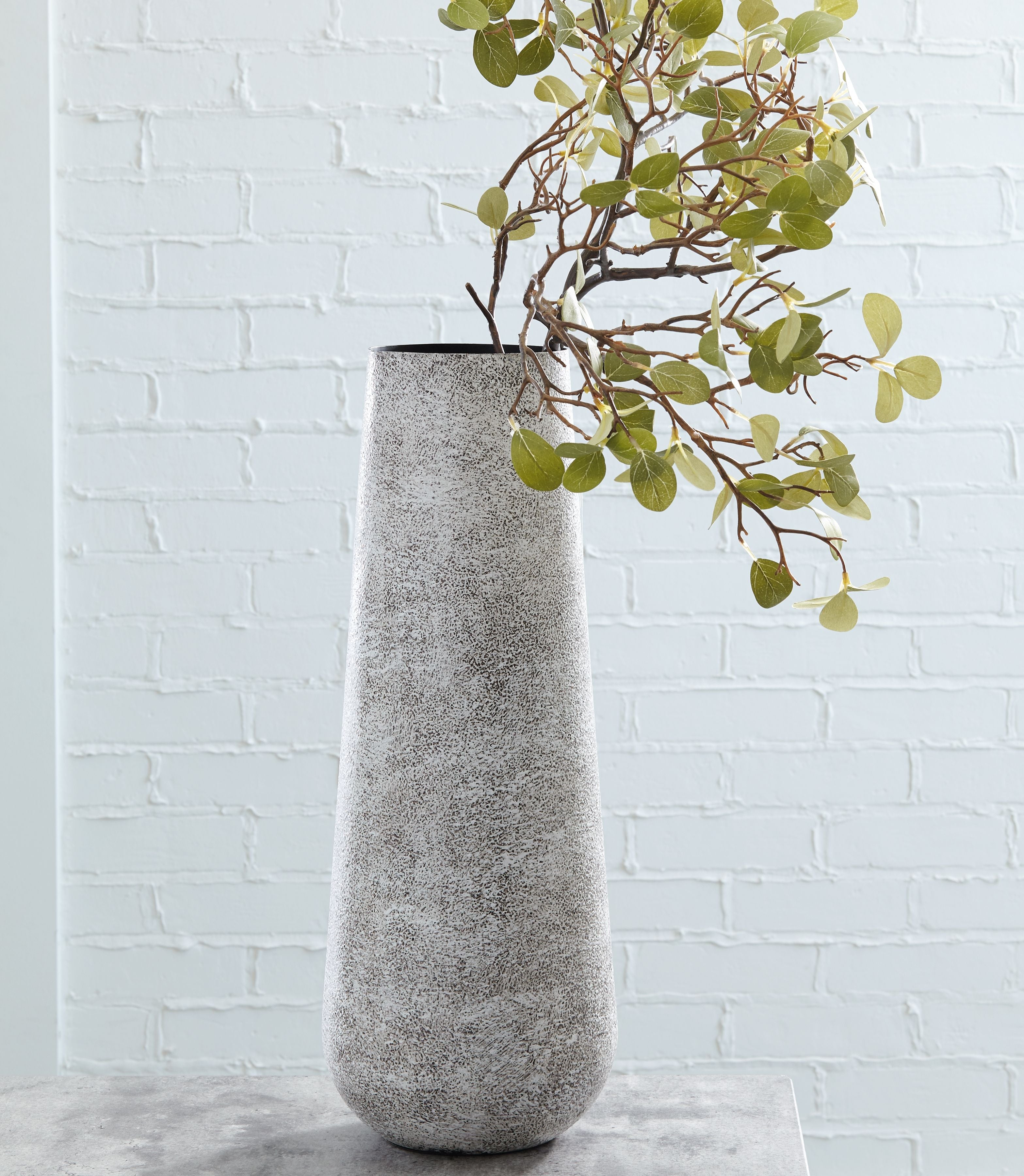 Tall ceramic vase in light gray with speckled texture, wide rounded rim and base.