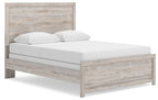 Panel bed frame in light brown woodgrain with white upholstered mattress and two pillows