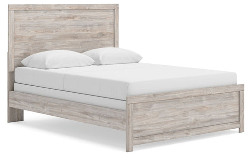Panel bed frame in light brown woodgrain with white upholstered mattress and two pillows
