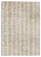 Light brown area rug with mottled abstract pattern, rectangular flat weave