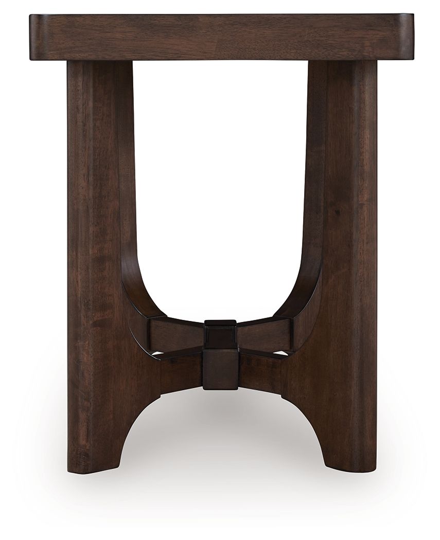 Dark brown rectangular cocktail table with arched side apron and center brace bar