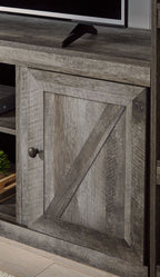 Gray cabinet door with diagonal inset panel and round knob