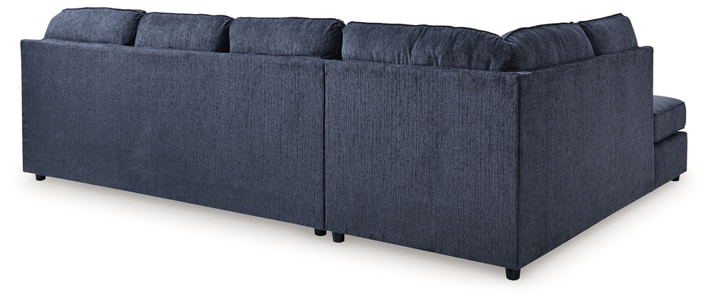 Blue sectional sofa with chaise, tufted back and box seat cushions