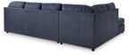 Blue sectional sofa with chaise, tufted back and box seat cushions