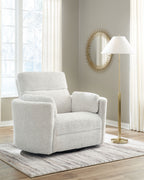 Swivel glider recliner chair in light cream with boxy arms and thick padded seat