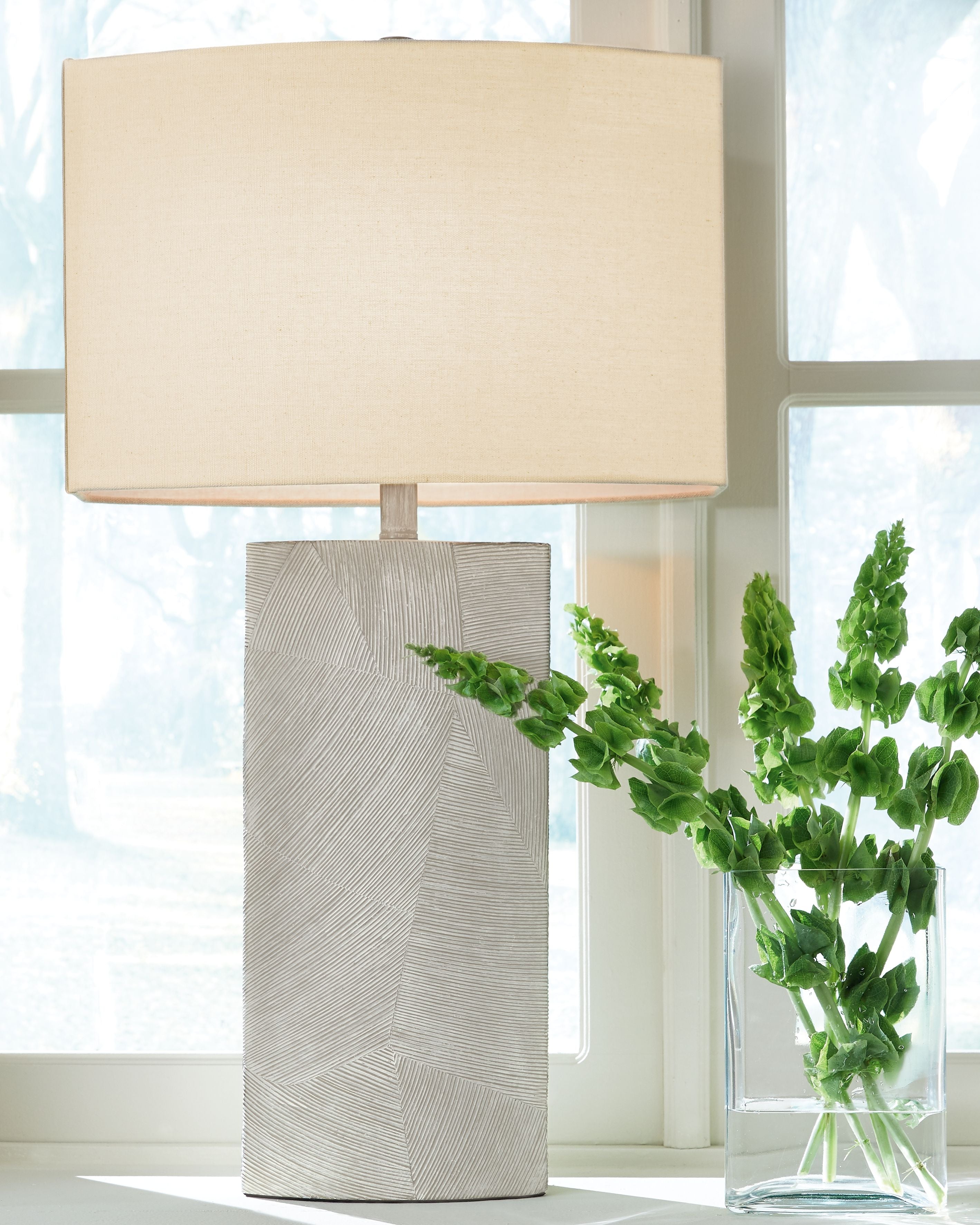 Table lamp with rectangular beige shade and textured light-gray poly body