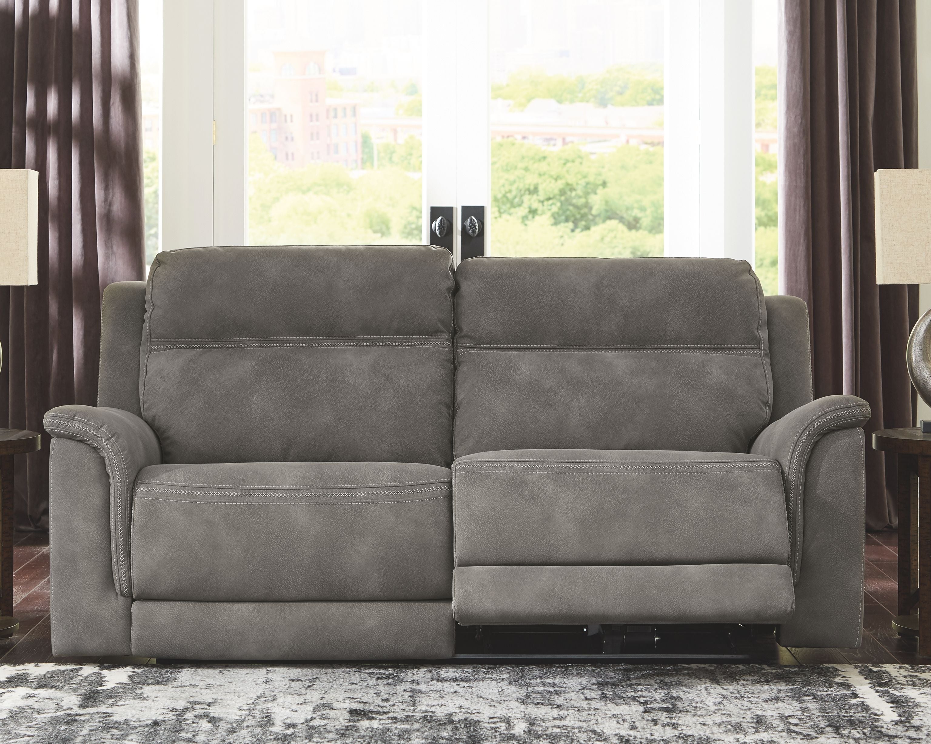 Power reclining sofa, dark slate gray with plush back cushions and padded armrests