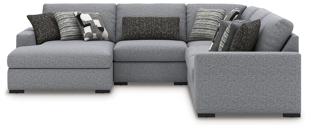 Gray sectional sofa with chaise arm and patterned throw pillows