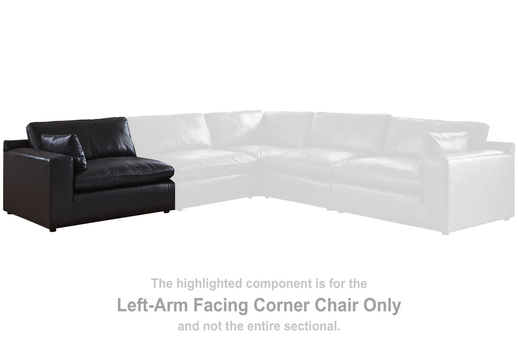Black corner sectional chair seat with left-facing arm and wide backrest, square legs.