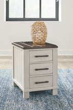 Chair side end table with dark brown slatted top and three stacked light gray drawer fronts