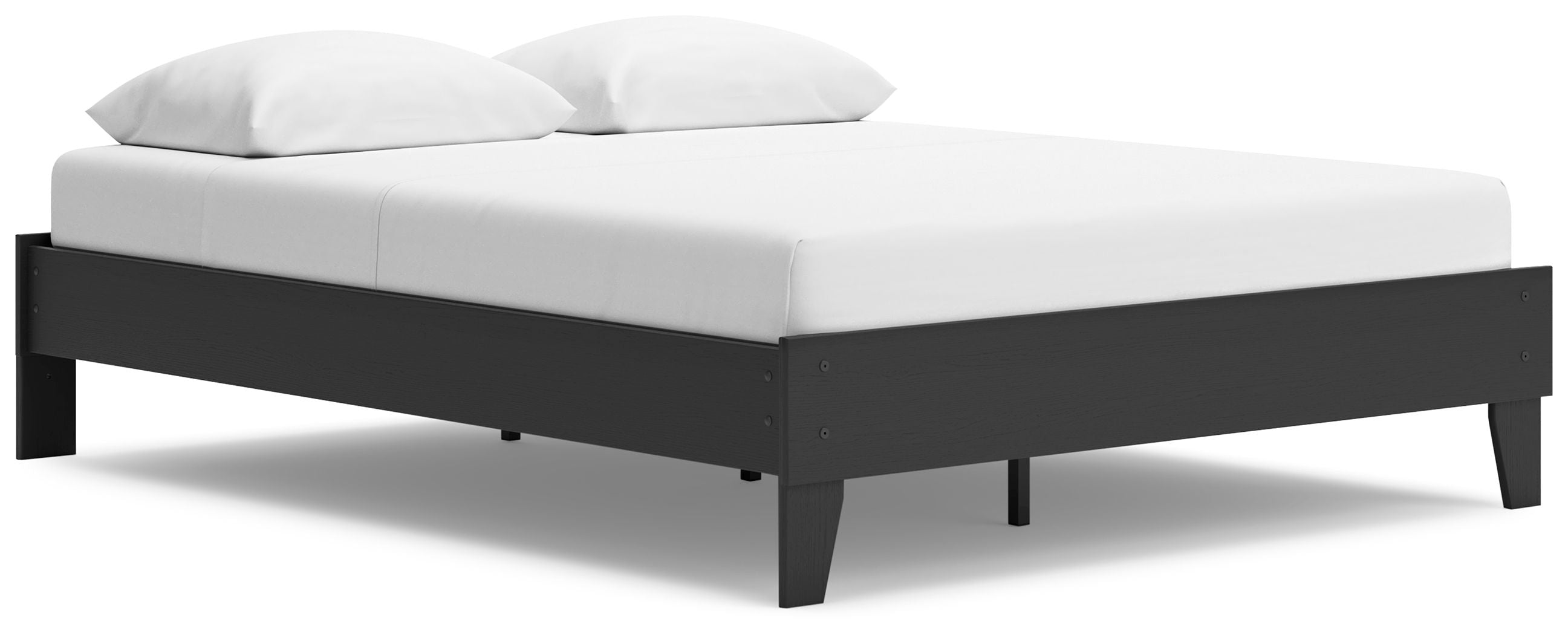 Platform bed with white mattress and dark wood frame, corner angle view