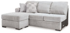Light gray fabric sofa chaise with left chaise extension and two throw pillows