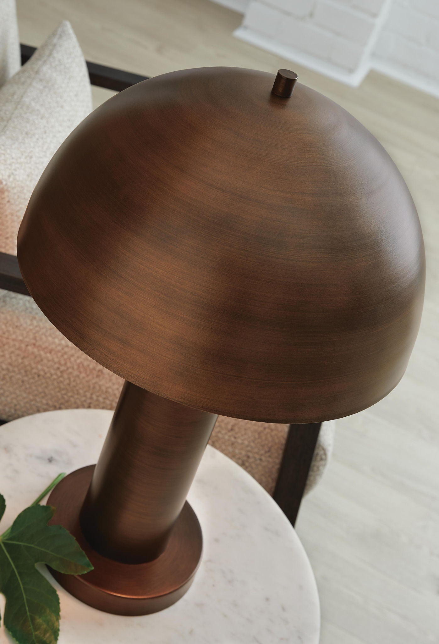 Dark bronze metal lamp with rounded dome shade and short stem base