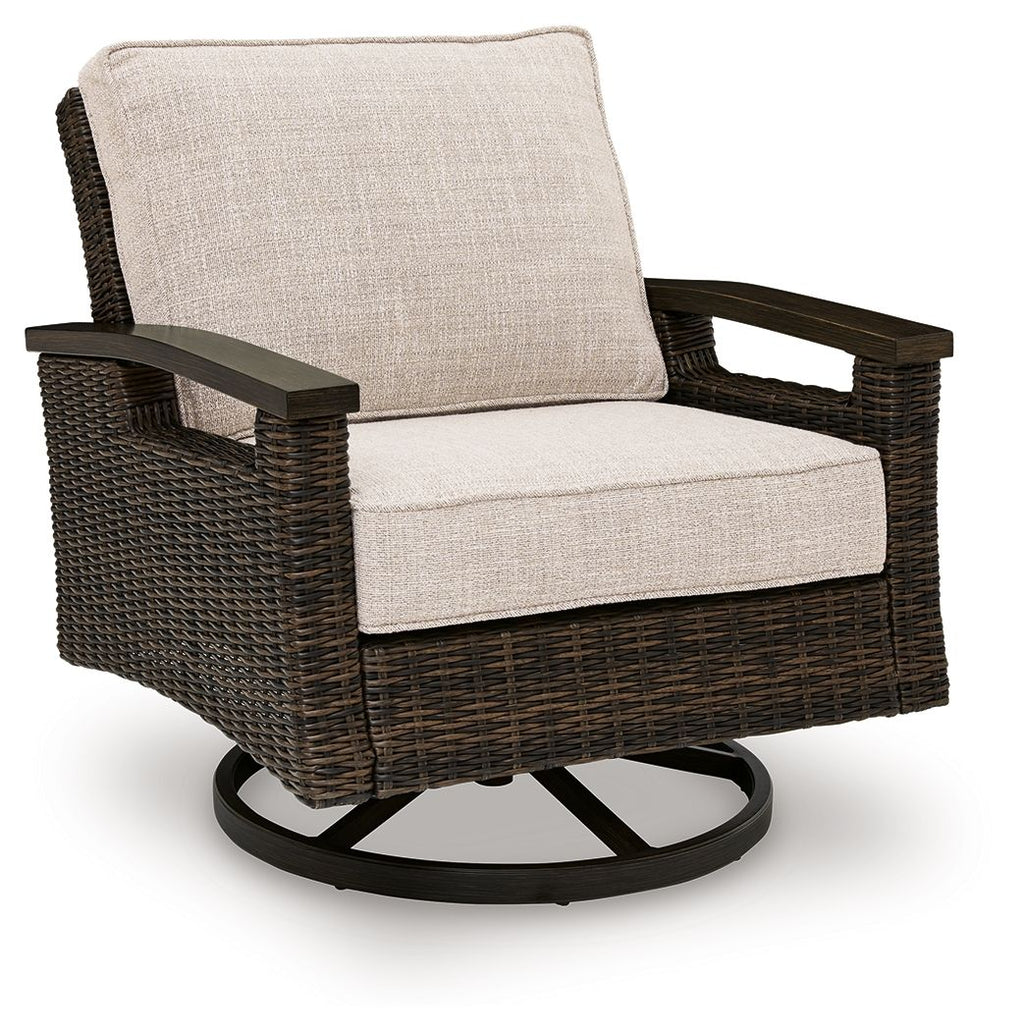 Swivel lounge chair with dark brown woven wicker frame and light beige seat and back cushions
