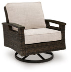 Swivel lounge chair with dark brown woven wicker frame and light beige seat and back cushions