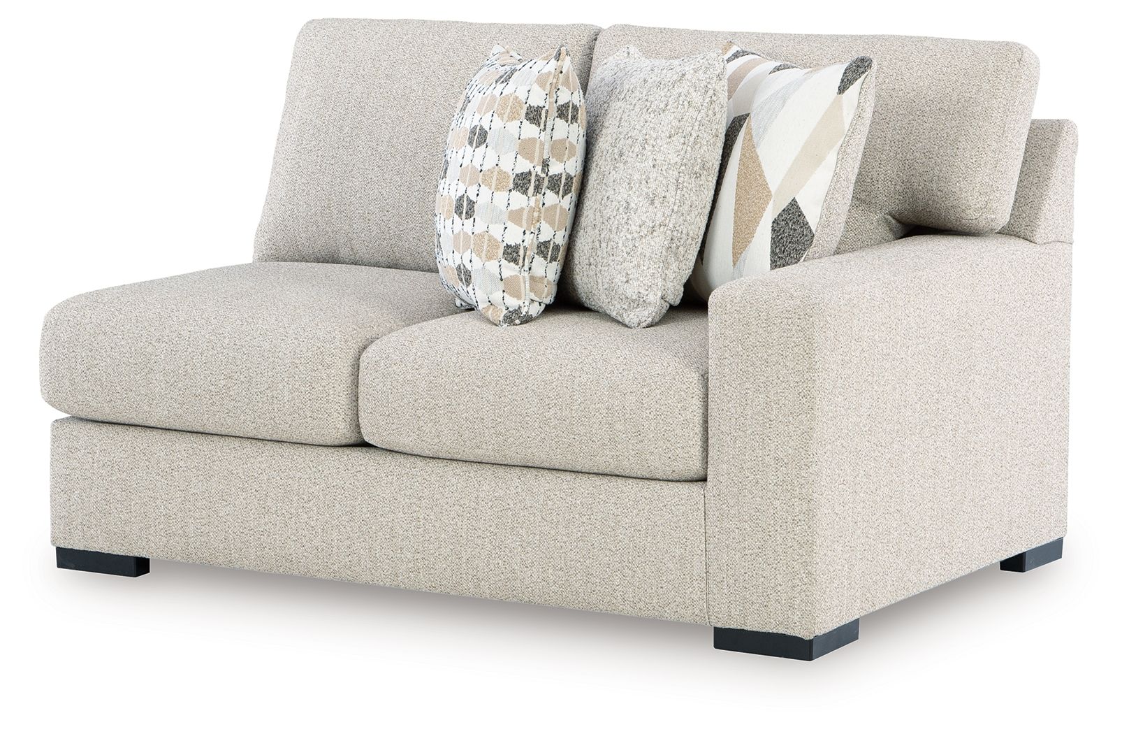 Pebble light-gray loveseat with armrests, black feet, and geometric patterned pillows
