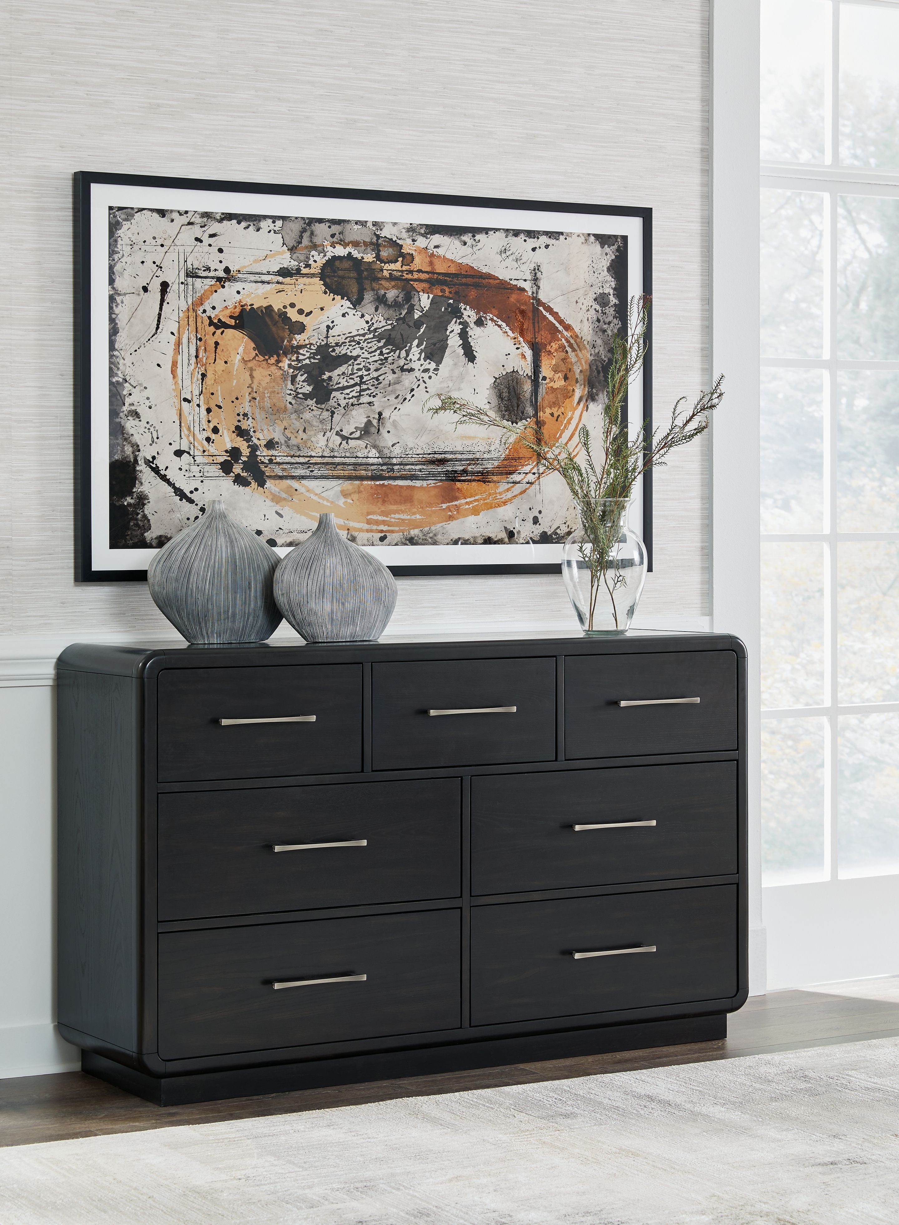 Black dresser with 9 drawers and silver bar handles, low wide cabinet