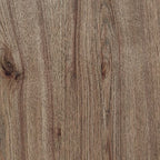 Close-up of light brown wood grain on a round table top and shelf surface.