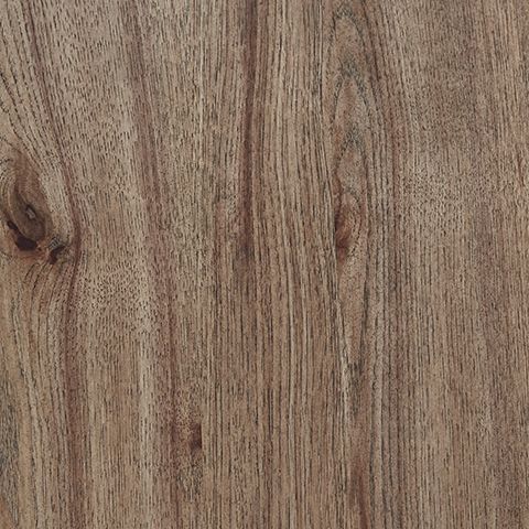 Close-up of light brown wood grain on a round table top and shelf surface.