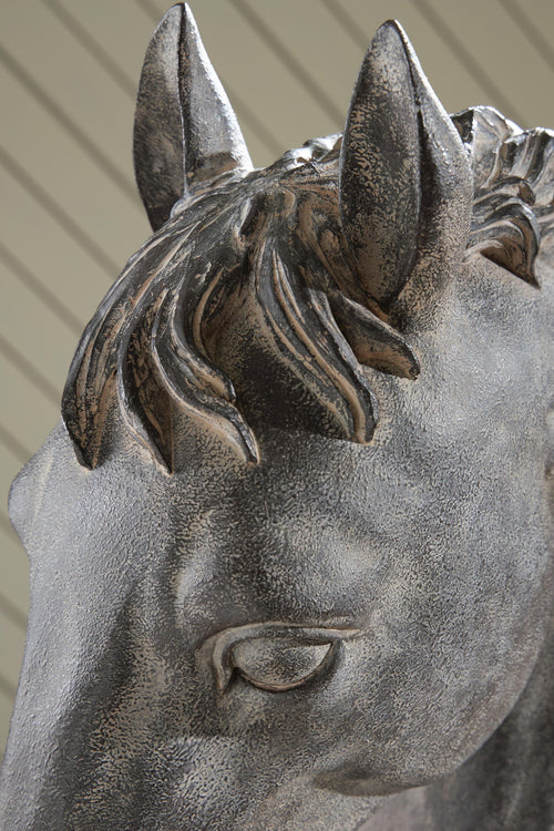Horse head sculpture in antique dark black with detailed ears and flowing mane