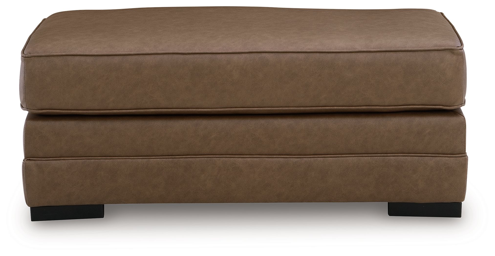 Caramel ottoman with thick padded top, stitched seams, and dark legs
