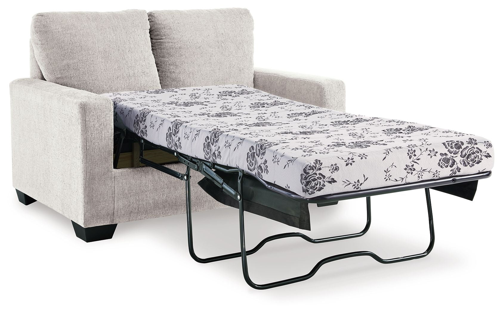 Light beige sofa bed with pulled-out mattress and floral patterned cover