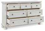 White dresser with six front drawers and round knobs, panel sides