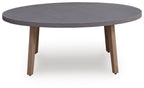 Oval gray cocktail table with four tapered legs, side view