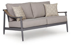 Gray loveseat with seat cushion and two patterned throw pillows