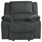 Slate fabric rocker recliner chair with high backrest and rounded arm cushions