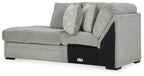 Corner chaise sofa with cement-gray upholstery, geometric throw pillow, black arms