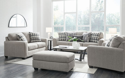 Gray living room seating set with two armchairs, loveseat, and ottoman