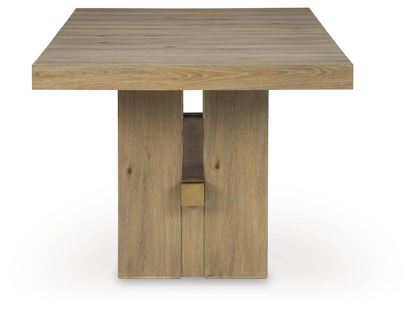 Light brown dining table with square pedestal base and ribbed-looking tabletop grain