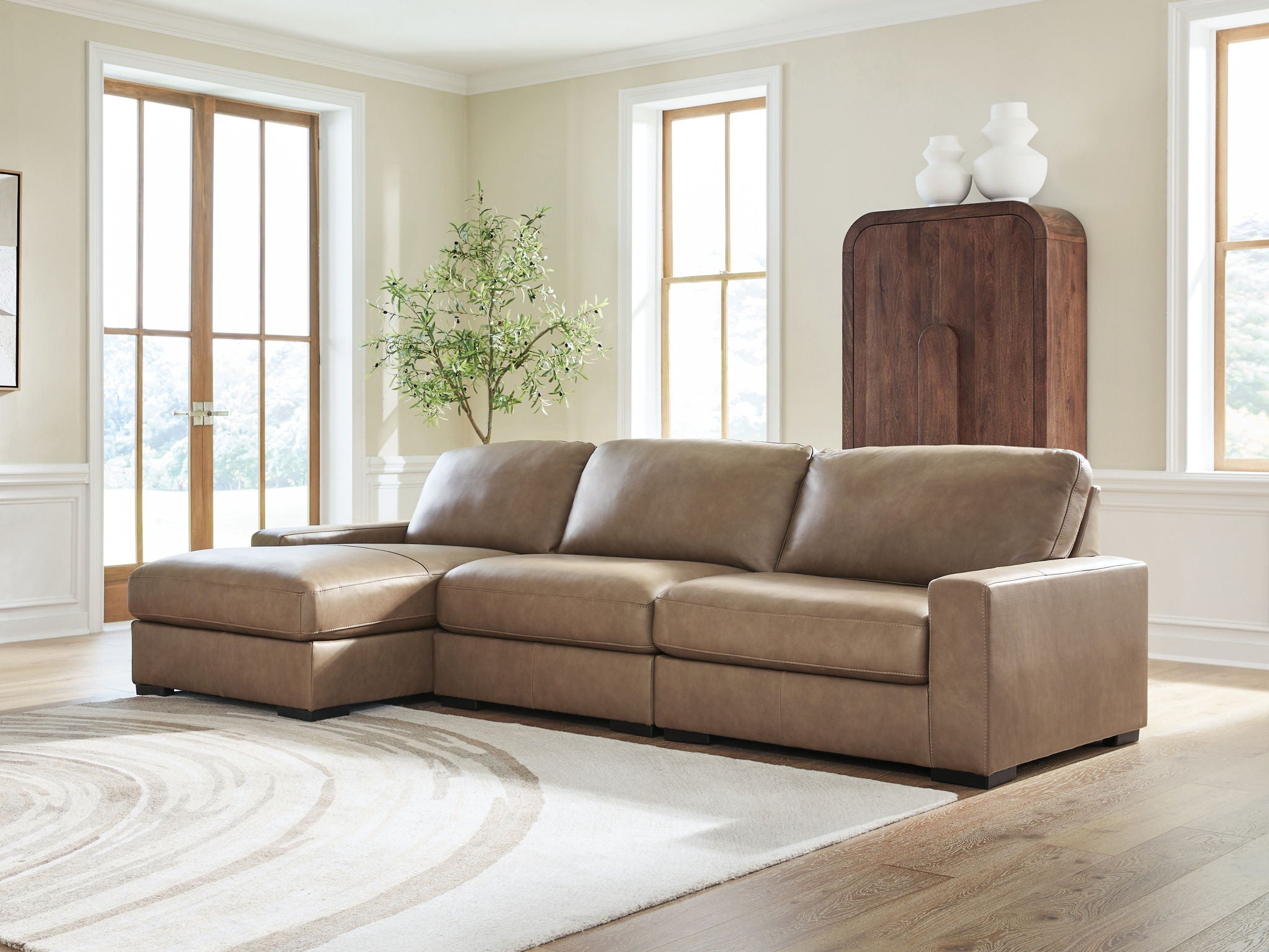 Sahara sectional sofa with chaise section, padded arms, and back cushions
