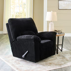 Onyx black striped rocker recliner chair with padded arms and pull handle in an indoor setting