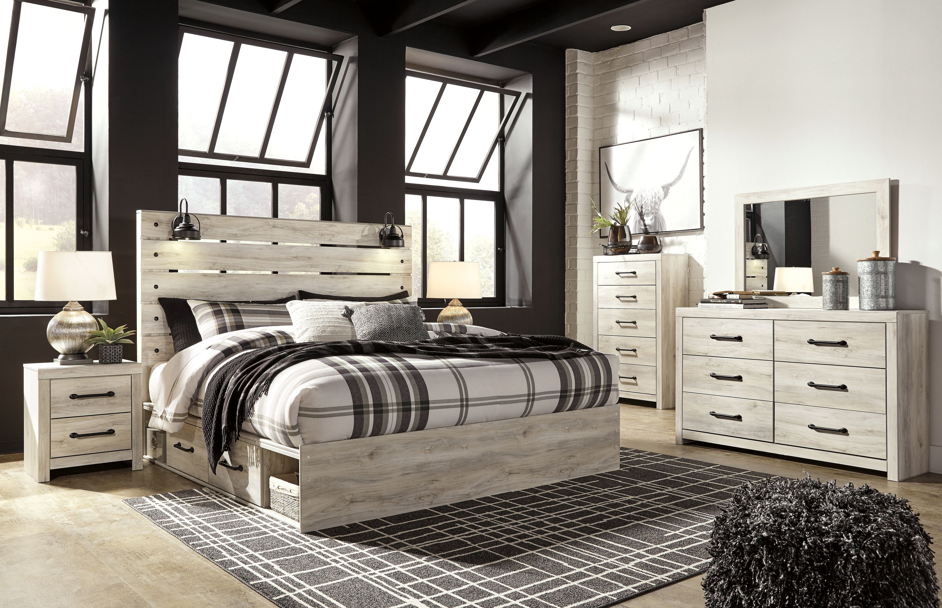 Bedroom furniture set with light wood bed and matching dresser, mirror, and drawer storage