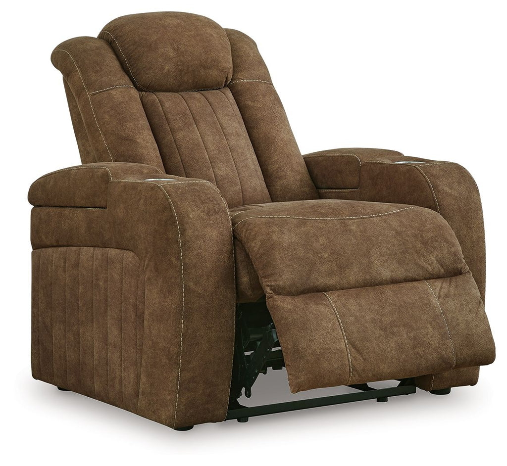 Brown power recliner in reclined position with adjustable headrest and padded arms