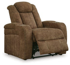 Brown power recliner in reclined position with adjustable headrest and padded arms