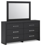 Black dresser with attached mirror and four drawers with silver bar pulls