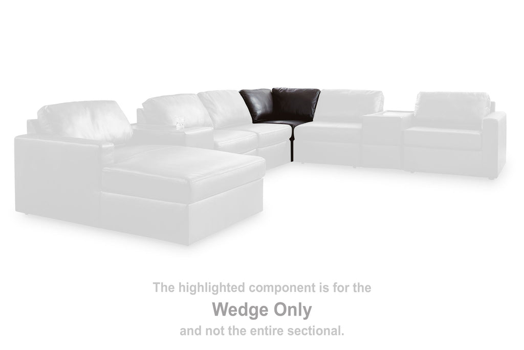 White sectional wedge module with padded seat and back cushions