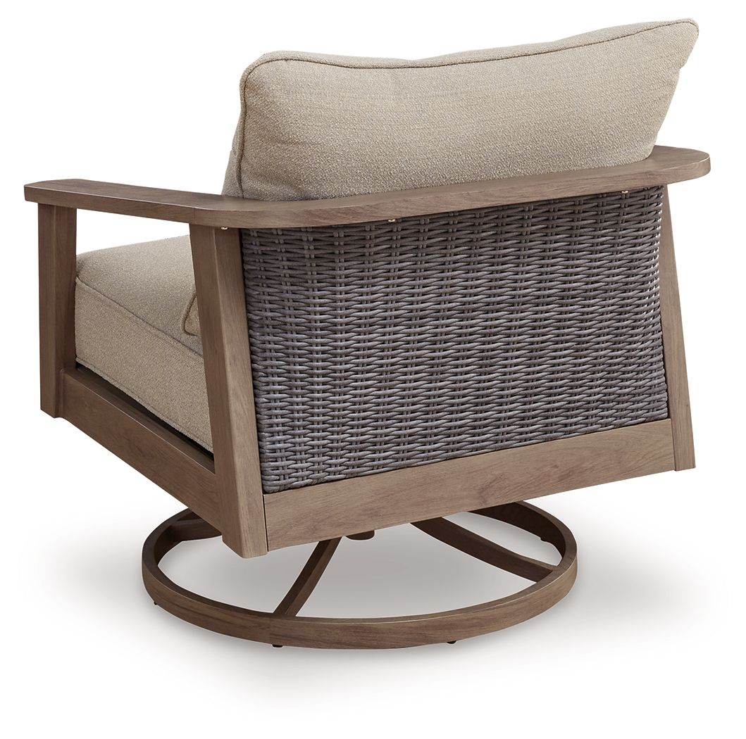 Swivel lounge chair with beige cushions and woven wicker side panel