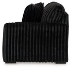 Onyx dark velvet sofa with vertical channel back and rounded thick arms