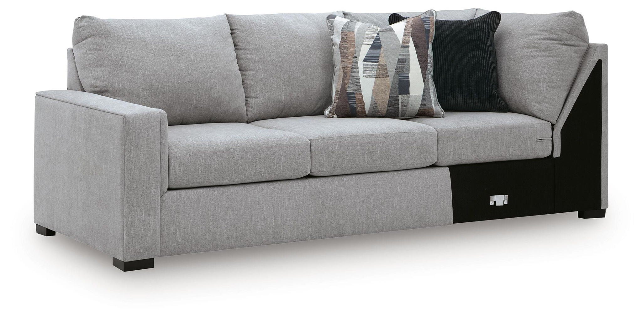 Grey upholstered sofa with corner wedge, black base panels, two front armrests and cushions